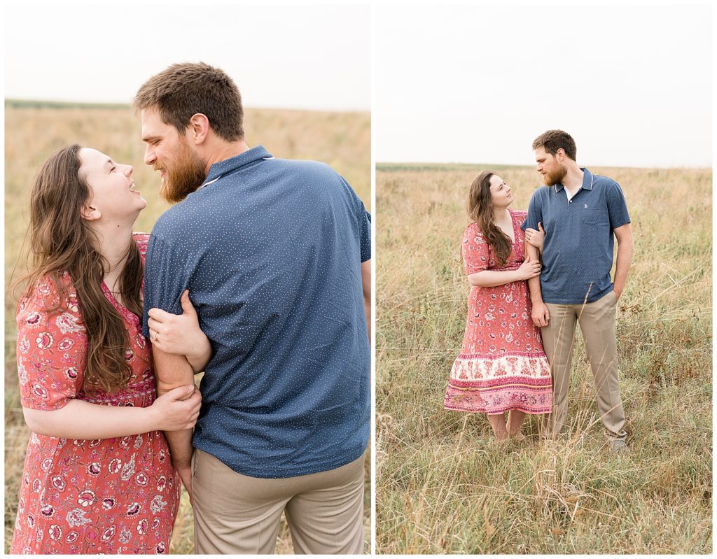 Couple laughing while standing in the meadow